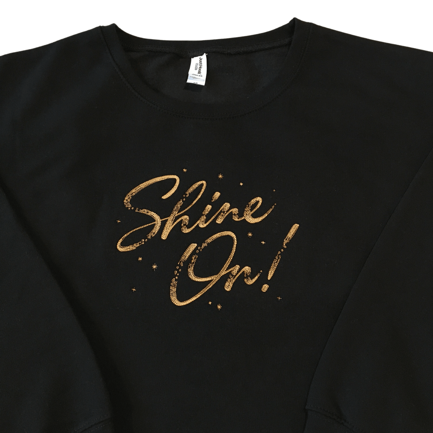 women shine on black cropped sweatshirt front middle