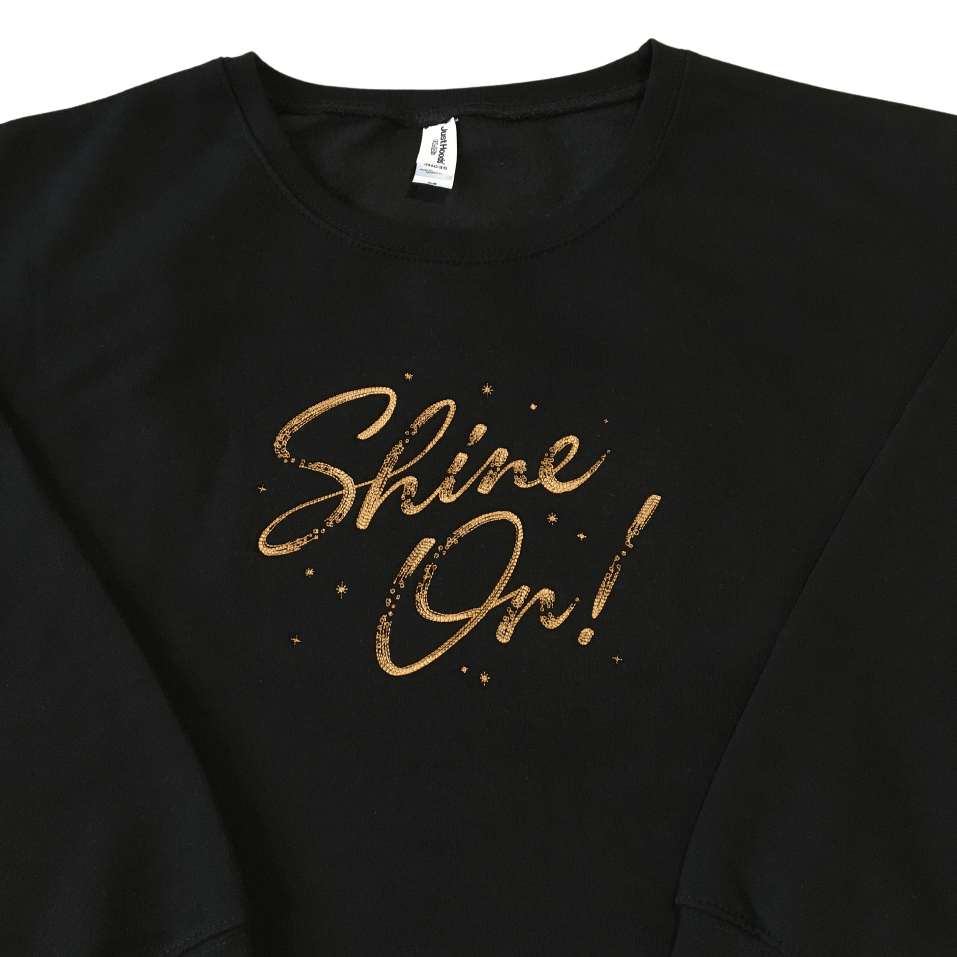 women shine on black cropped sweatshirt front middle