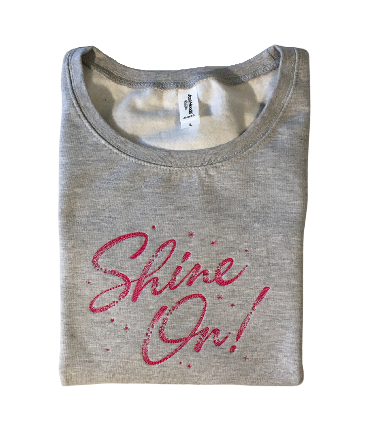 women shine on grey cropped sweatshirt front closeup